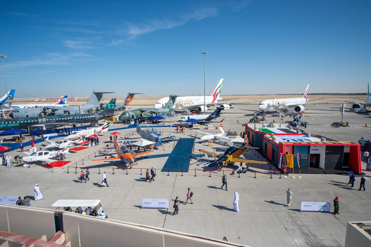 People visit 'Dubai Airshow 2023', the largest aerospace and defense event in the Middle East, at Al Maktoum International Airport, in Dubai, United Arab Emirates on November 13, 2023. [Waleed Zein - Anadolu Agency]