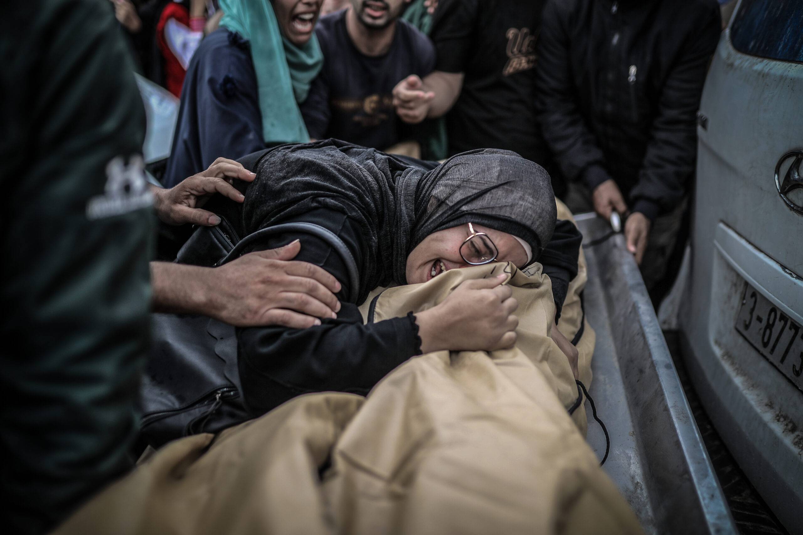 Relatives of the victims, died in the Israeli airstrikes, mourn as they take the bodies from the morgue of Nasser Hospital for the funeral ceremony as the Israeli army attacks continue in Khan Yunis, Gaza on November 14, 2023 [Belal Khaled - Anadolu Agency]