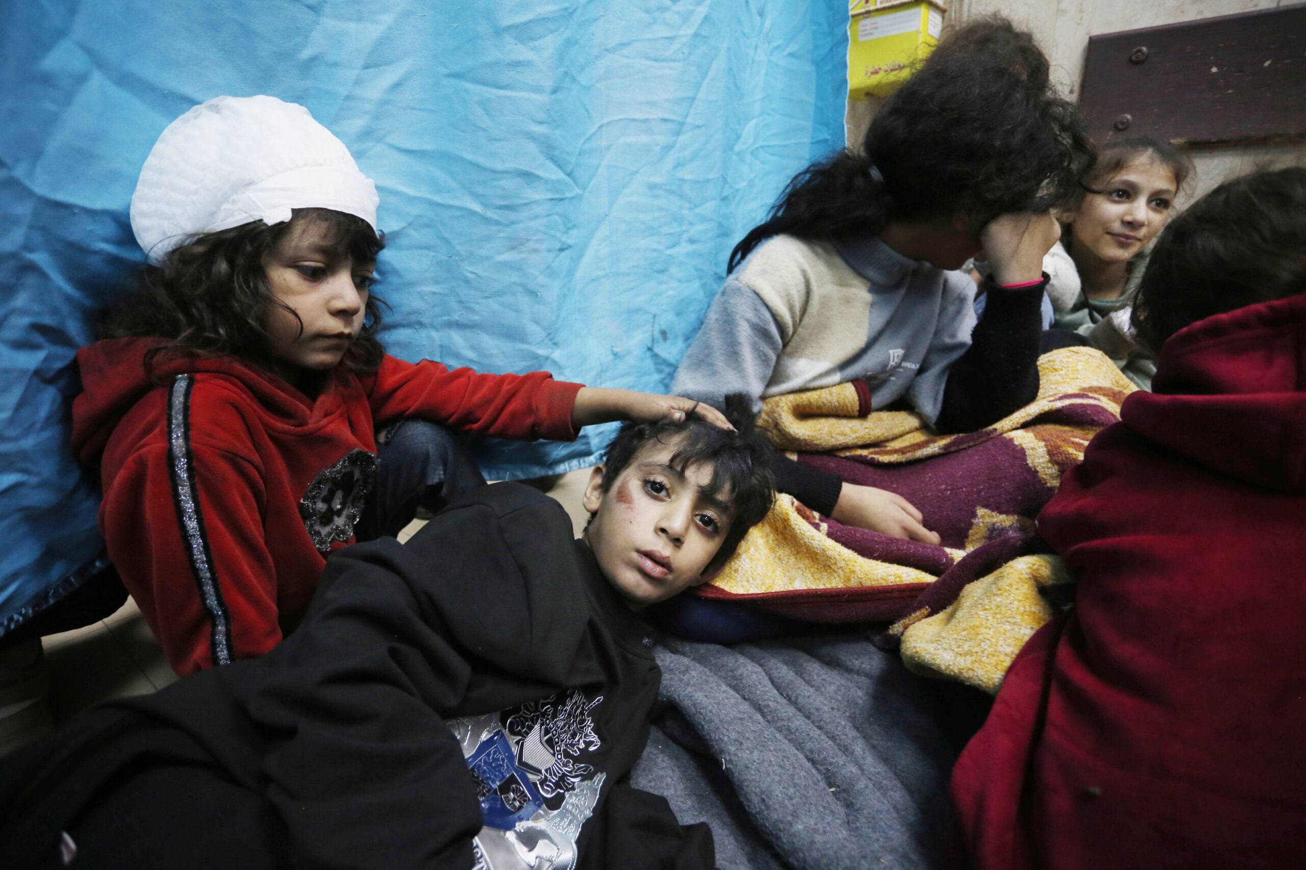 Injured Palestinians, including children, are being taken to Al-Aqsa Martyrs Hospital for treatment after the Israeli attacks hit the school at Al Bureij Refugee Camp as Israeli attacks continue on the 45th day in Deir Al Balah, Gaza on November 20, 2023 [Ashraf Amra - Anadolu Agency]