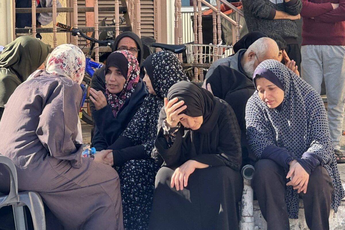 Relatives of Palestinians who lost their lives in Israeli attacks, mourn as the bodies are taken from morgue of Al-Aqsa Martyr's Hospital to bury on the 46th day of Israeli attacks in Deir al-Balah, Gaza on November 21, 2023 [Doaa Albaz/Anadolu Agency]