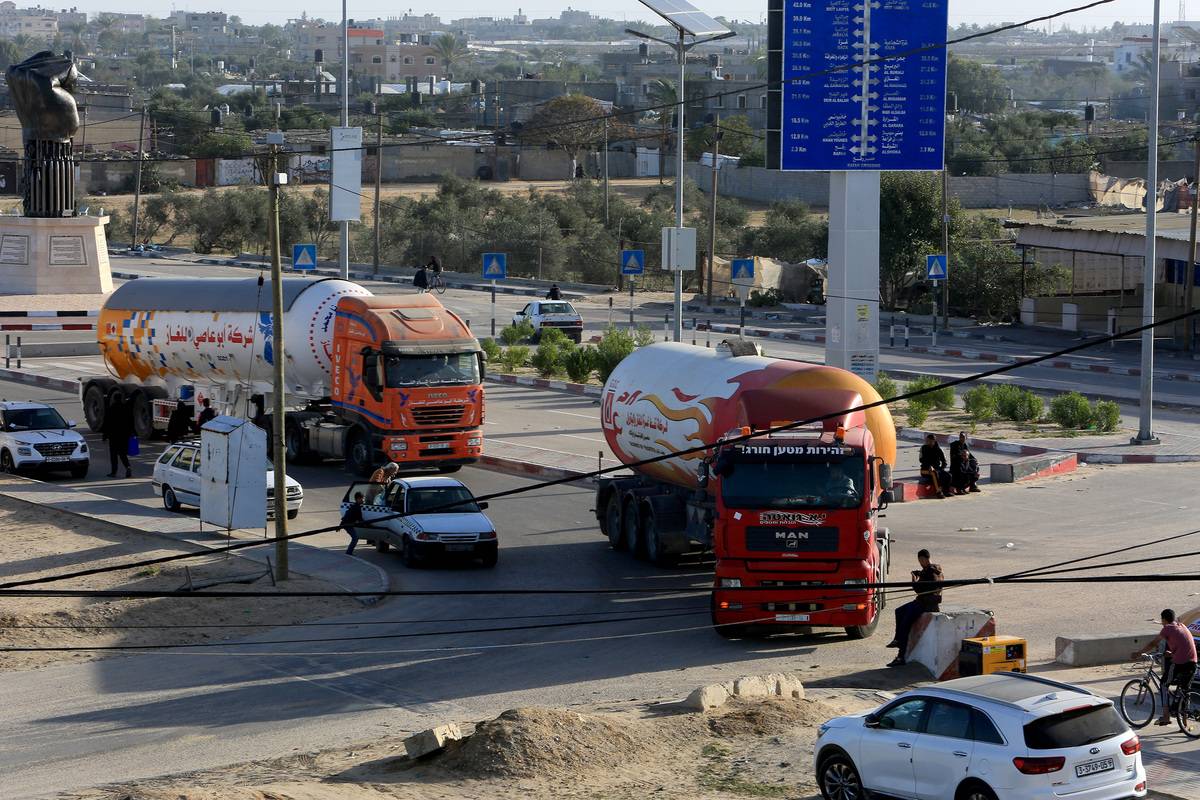 Trucks carrying fuel and food aid crossing into Gaza Strip through Rafah border crossing with Egypt on November 24, 2023. [Abed Rahim Khatib - Anadolu Agency]