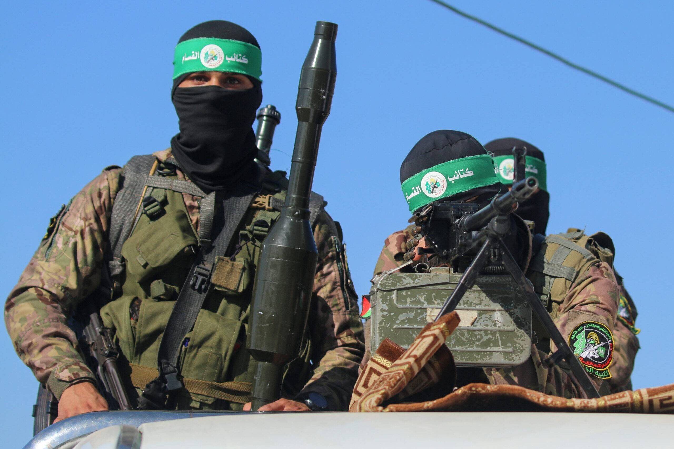 Fighters of the Izz al-Din al-Qassam Brigades, the military wing of Hamas, display their combat weapons in Maghazi camp July 19, 2023 [Ahmed Hasaballah/Getty Images]