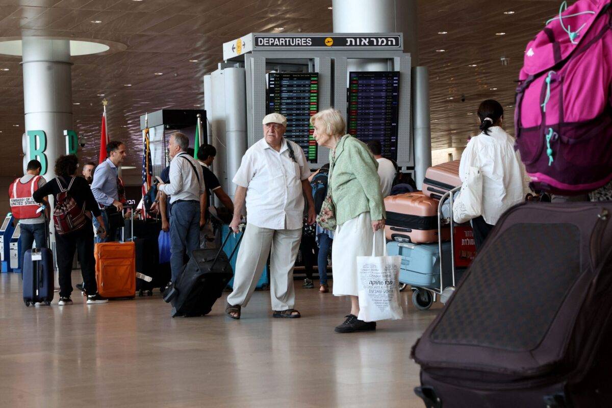 Travellers arrive to check-in at Ben Gurion International Airport near Tel Aviv on October 14, 2023 GIL COHEN-MAGEN/AFP via Getty Images]