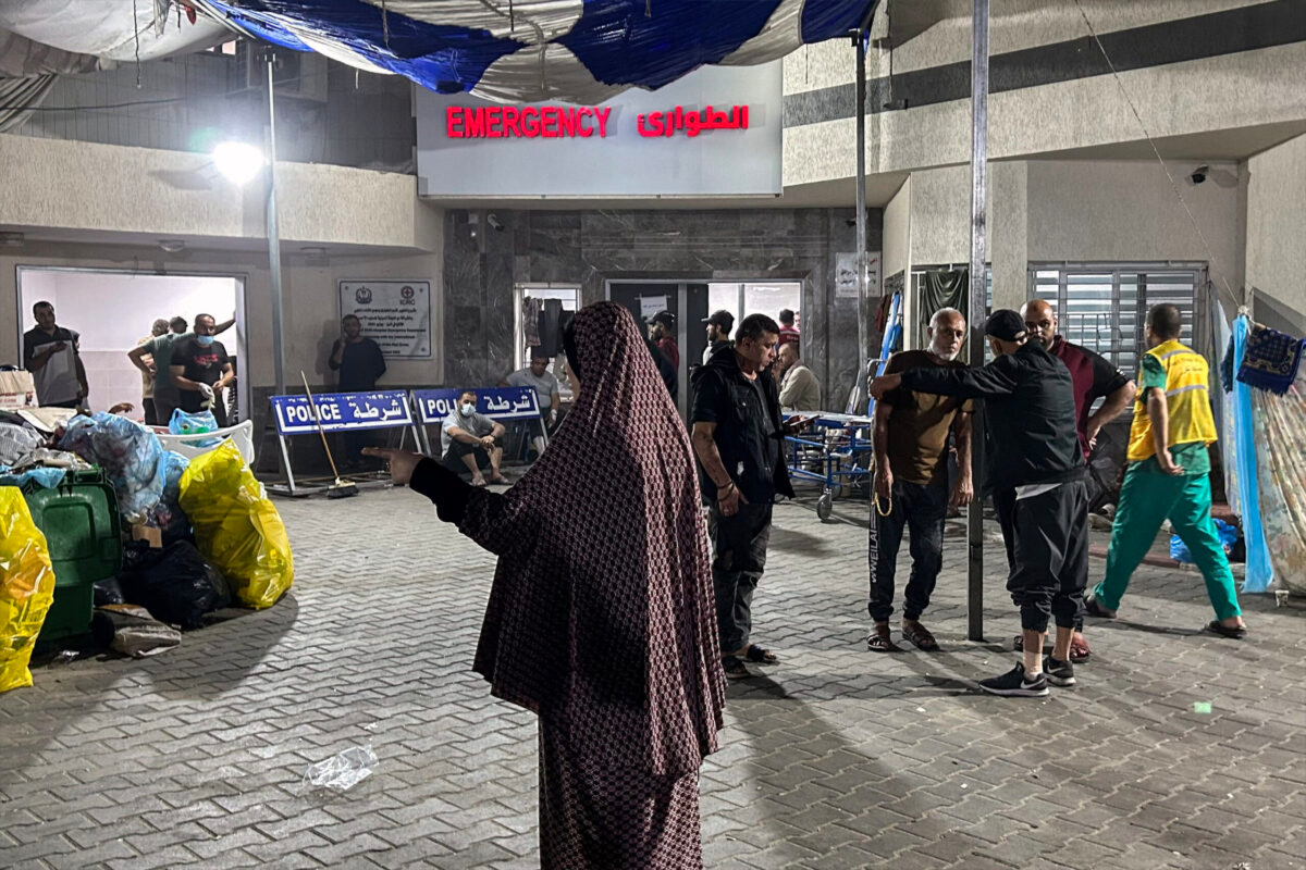 People stand outside the emergency ward of Al-Shifa hospital in Gaza City on November 10, 2023 [AFP via Getty Images]