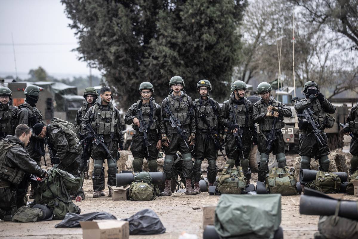 Israeli soldiers, tanks, howitzers and armored vehicles are seen on the Gaza border, in Nahal Oz, Israel on December 13, 2023 [Mostafa Alkharouf/Anadolu Agency]