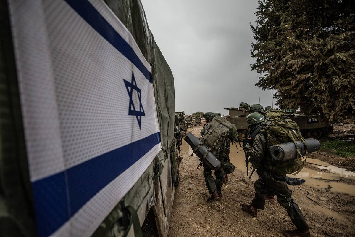 Israeli soldiers, tanks, howitzers and armored vehicles are seen as Israeli military mobility continues on the Gaza border, in Nahal Oz, Israel on December 13, 2023 [Mostafa Alkharouf - Anadolu Agency]