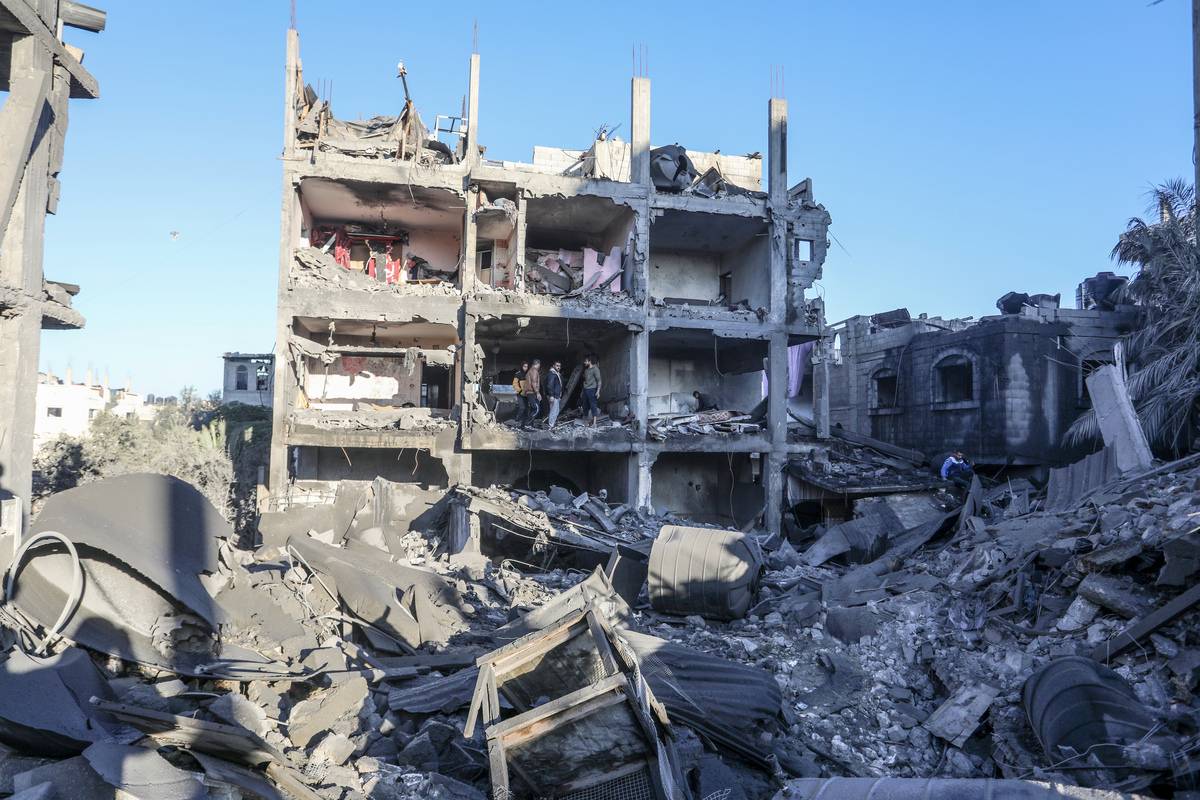 Civil defense teams and Palestinians conduct search and rescue operations among the rubble of buildings destroyed by Israeli attacks in Rafah, Gaza on December 15, 2023. [Abed Rahim Khatib - Anadolu Agency]