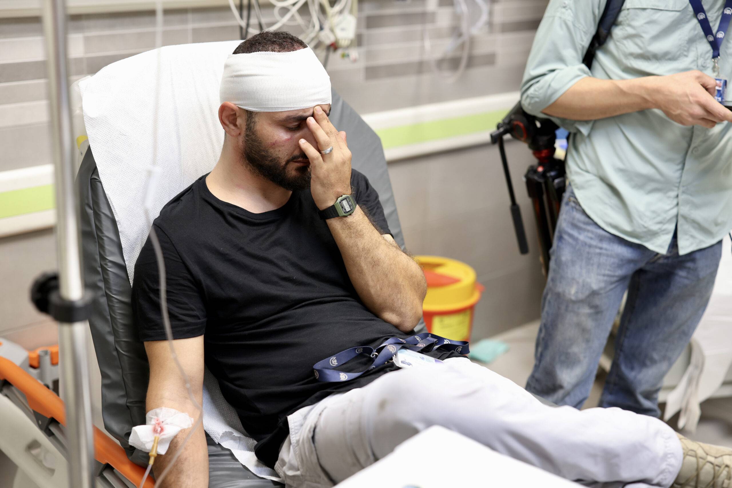Anadolu photojournalist Mostafa Alkharouf is hospitalized after being assaulted by Israeli army while he was on duty covering Palestinian gathering at Wadi al-Joz Neighborhood near Al-Aqsa Mosque in East Jerusalem on December 15, 2023 [Eyad Tawil - Anadolu Agency]