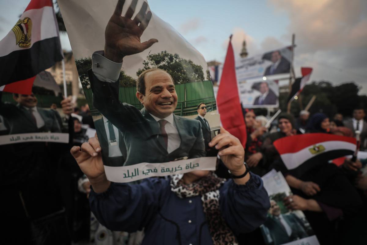 People celebrate after Egypt's incumbent President Abdel-Fattah al-Sisi was reelected to a third, six-year term in office in Cairo, Egypt on December 18, 2023 [Mohamed Elshahed/Anadolu Agency]