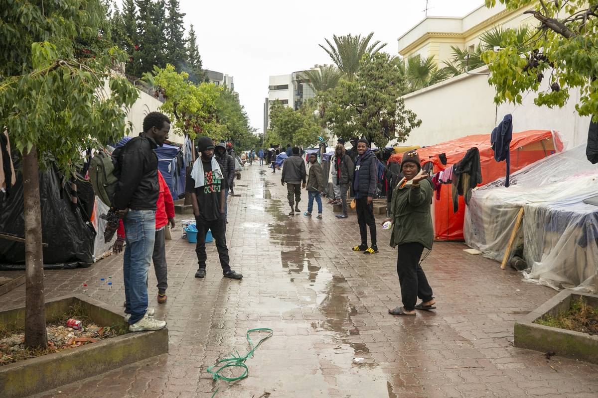 African migrants, who arrived in the country illegally, are seen on the street with their limited sources during the International Migrants Day in Tunis, Tunisia on December 18, 2023. [Yassine Gaidi - Anadolu Agency]