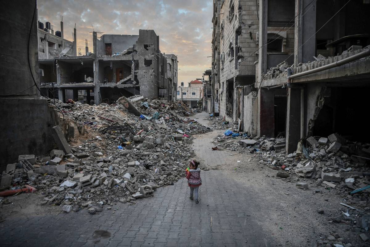 A child walks among rubbles of the destroyed buildings due to ongoing Israeli attacks on Gaza on December 21, 2023 in Rafah, Gaza. [Abed Zagout - Anadolu Agency]