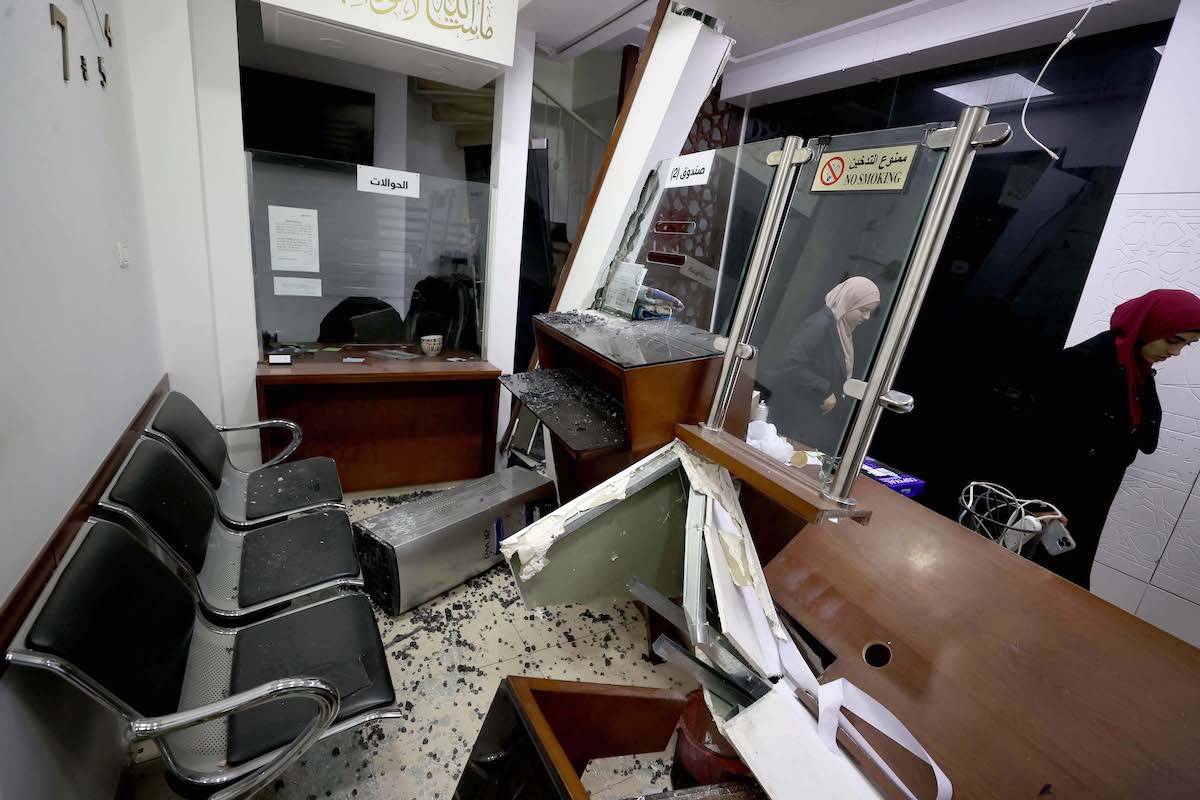 Palestinian people inspect the damage after a goldsmith shop raided by Israeli forces as 13 Palestinian injuries and 1 killed is reported in Ramallah, West Bank on September 28, 2023. [Issam Rimawi - Anadolu Agency]