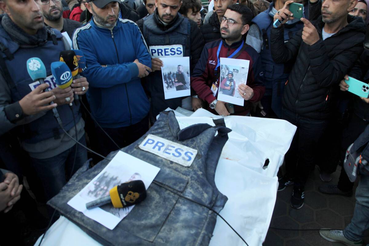 Al-Quds TV journalist Cebr Abu Hedrus', who died in Israeli attacks on Nuseirat refugee camp, vest and microphone are seen during his funeral ceremony in Deir al-Balah, Gaza [Ashraf Amra - Anadolu Agency]
