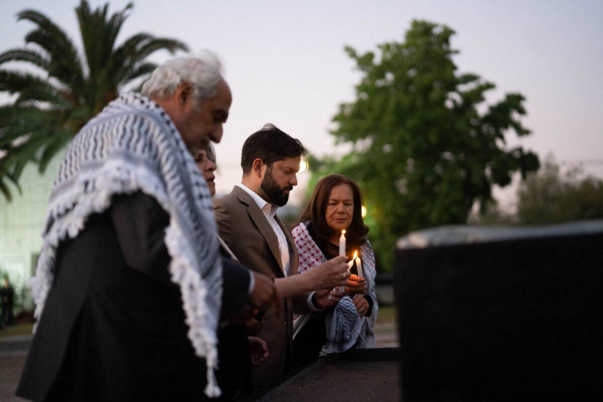 The Chilean President participates in lightining the candles for Gaza with the Palestinian community in Santiago, December 2023. [source: Palestinian community in Chile/MEMO]
