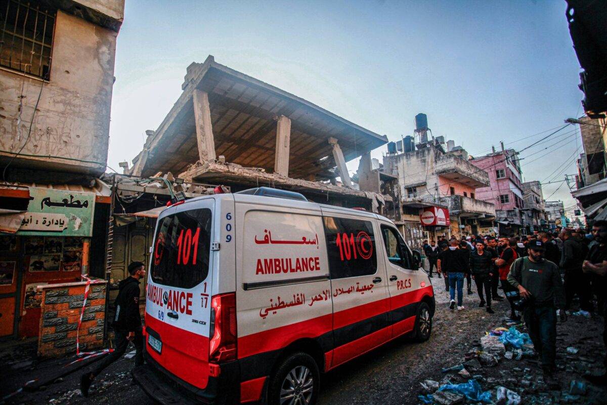 A Palestinian Red Crescent ambulance passes through the area where the Israeli military struck in the occupied West Bank on 18 November 2023 (Photo by Nasser Ishtayeh/SOPA Images/LightRocket via Getty Images]