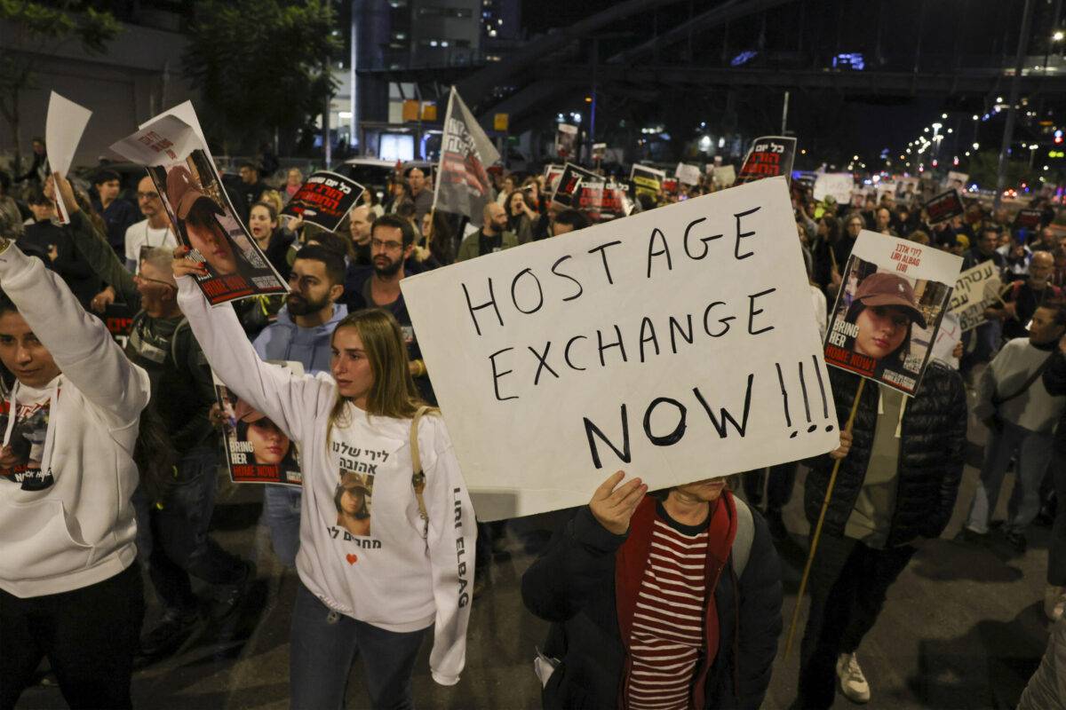 Families and supporters of hostages hostages held by Palestinian militants since the October 7 attack hold a demonstration outside the Israeli ministry of defence in Tel Aviv on December 15, 2023 [AHMAD GHARABLI/AFP via Getty Images]