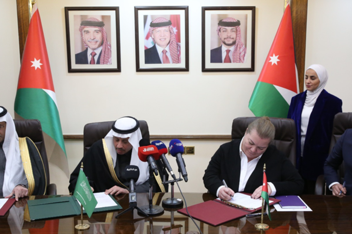 Jordan’s Minister of Planning and International Cooperation Zeina Toukan (centre right) and Saudi Ambassador Nayef Al-Sudairi (centre left) attend a ceremony to transfer a $38.6 million grant from Saudi to Jordan in Amman on 2 January 2024 [Petra]