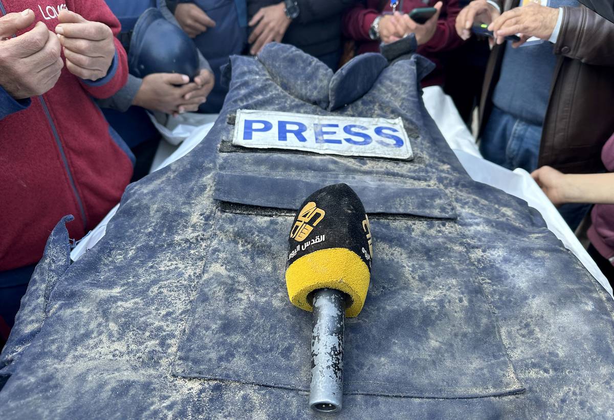 Al-Quds TV journalist Cebr Abu Hedrus', who died in Israeli attacks on Nuseirat refugee camp, vest and microphone are seen during his funeral ceremony in Deir al-Balah, Gaza on December 30, 2023. [Doaa Albaz - Anadolu Agency]