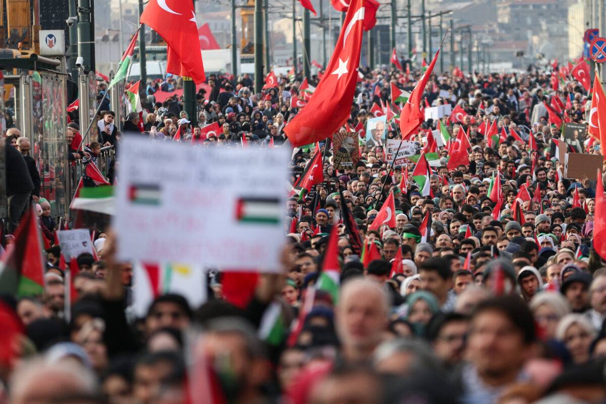 People gather with Turkish and Palestinian flags during a march in support of Palestinians. Participants arrived at Galata Bridge and gathered, in Istanbul, Turkiye on January 01, 2024 [Hakan Akgün/Anadolu Agency]