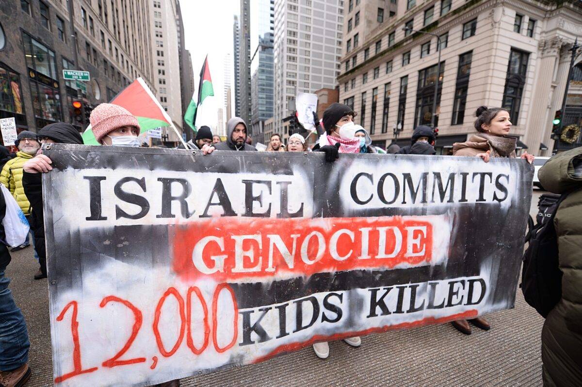 Pro-Palestinian demonstrators carrying Palestinian flags and banners gather at the "End the Year with Ending Genocide" rally in Chicago, United States on December 31, 2023 [Jacek Boczarski/Anadolu Agency]