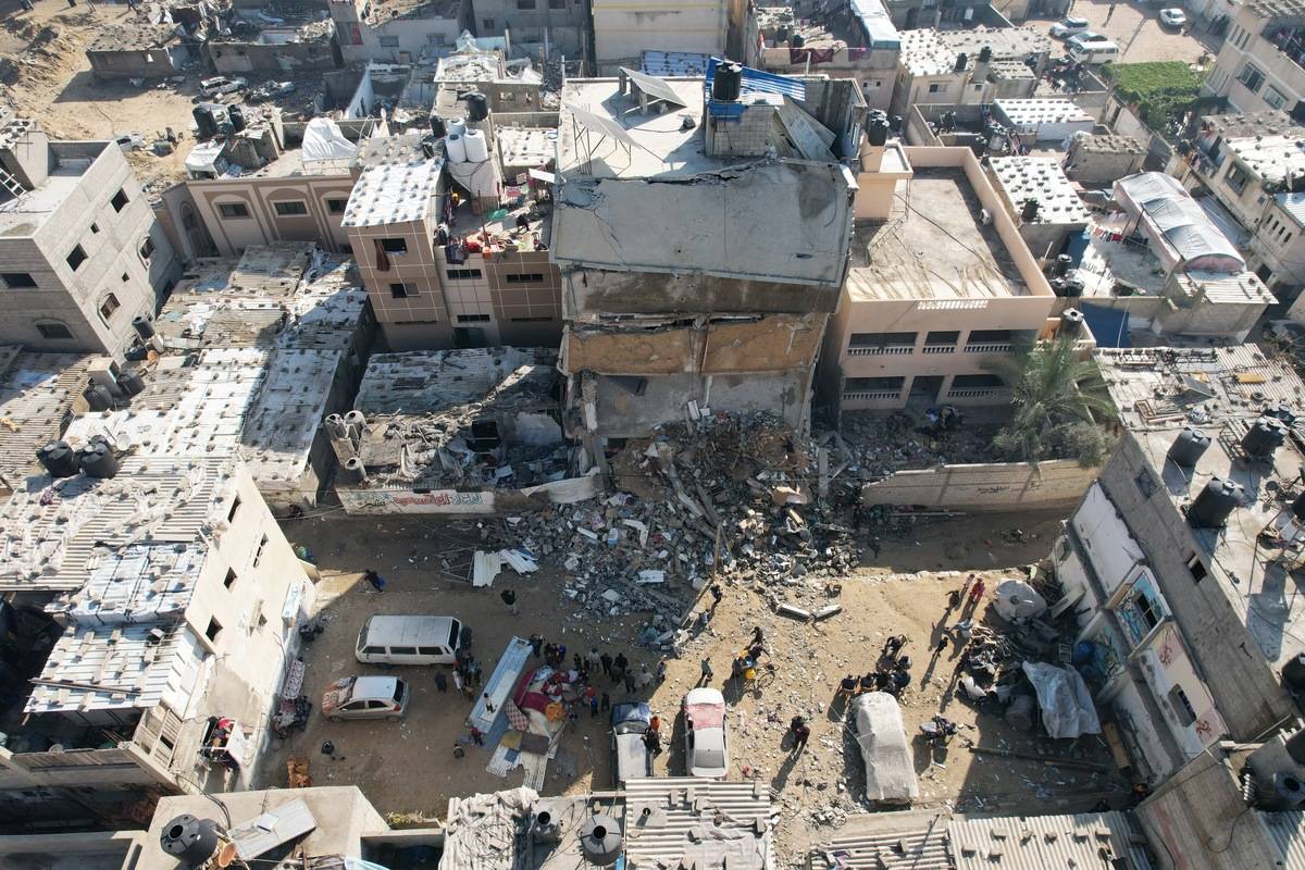 An aerial view of collapsed buildings as the Israeli airstrikes continue in Deri Al-Balah, Gaza on January 4, 2024 [Ashraf Amra/Anadolu Agency]