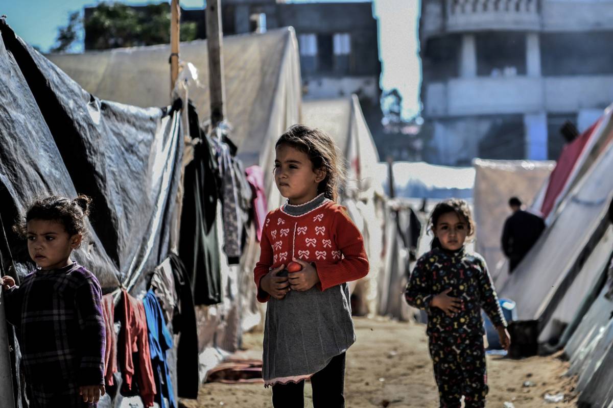 Children are seen in a makeshift tent camp as Palestinians who took refuge in the city of Rafah are trying to continue their daily work even though the attacks continue in Rafah, Gaza on January 06, 2024. [Abed Zagout - Anadolu Agency]