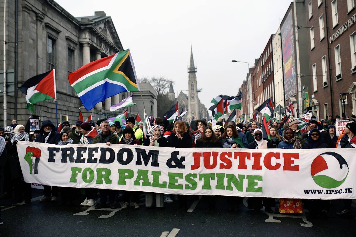 People, holding banners and Palestinian flags, gather to stage demonstration to show solidarity with Palestinians and demand permanent ceasefire in Gaza and to support South Africa case against Israel on January 13, 2024 in Dublin, Ireland. [Stringer - Anadolu Agency]