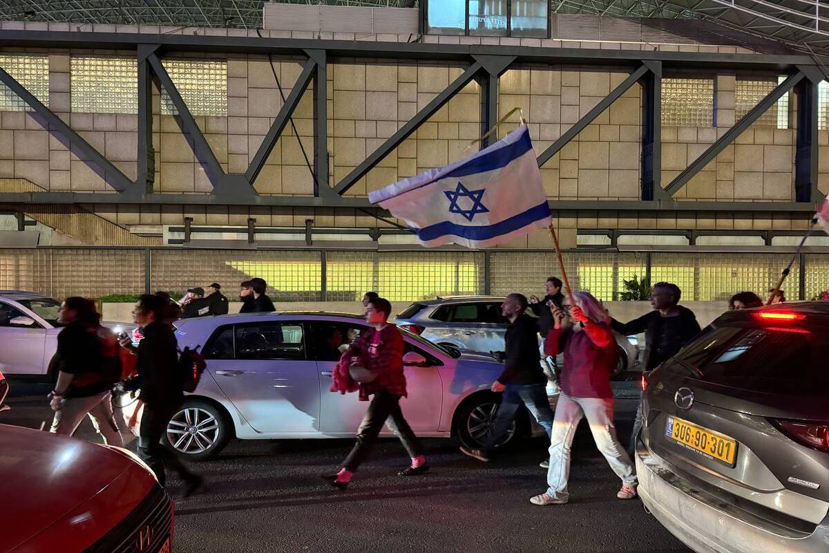 Anti-government protesters block the Ayalon Highway demanding the release of hostages held by Hamas in Tel Aviv, Israel on January 13, 2024 [Mostafa Alkharouf/Anadolu Agency]