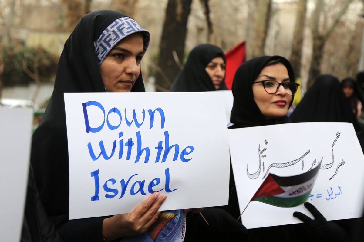 Palestine supporters gather in front of the United Nations (UN) Representative Office in Tehran to support the case filed by the Republic of South Africa against the actions of Israel to Gaza at the International Court of Justice (ICJ) on January 14, 2024, in Tehran, Iran. [Fatemeh Bahrami - Anadolu Agency]