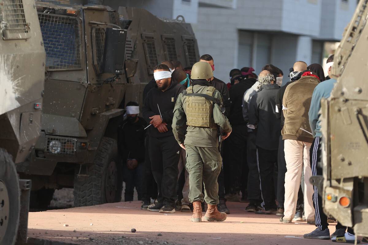 Israeli forces detain a number of Palestinians as they raid Tulkarm refugee camp in Tulkarm, West Bank on January 18, 2024. [İssam Rimawi - Anadolu Agency]
