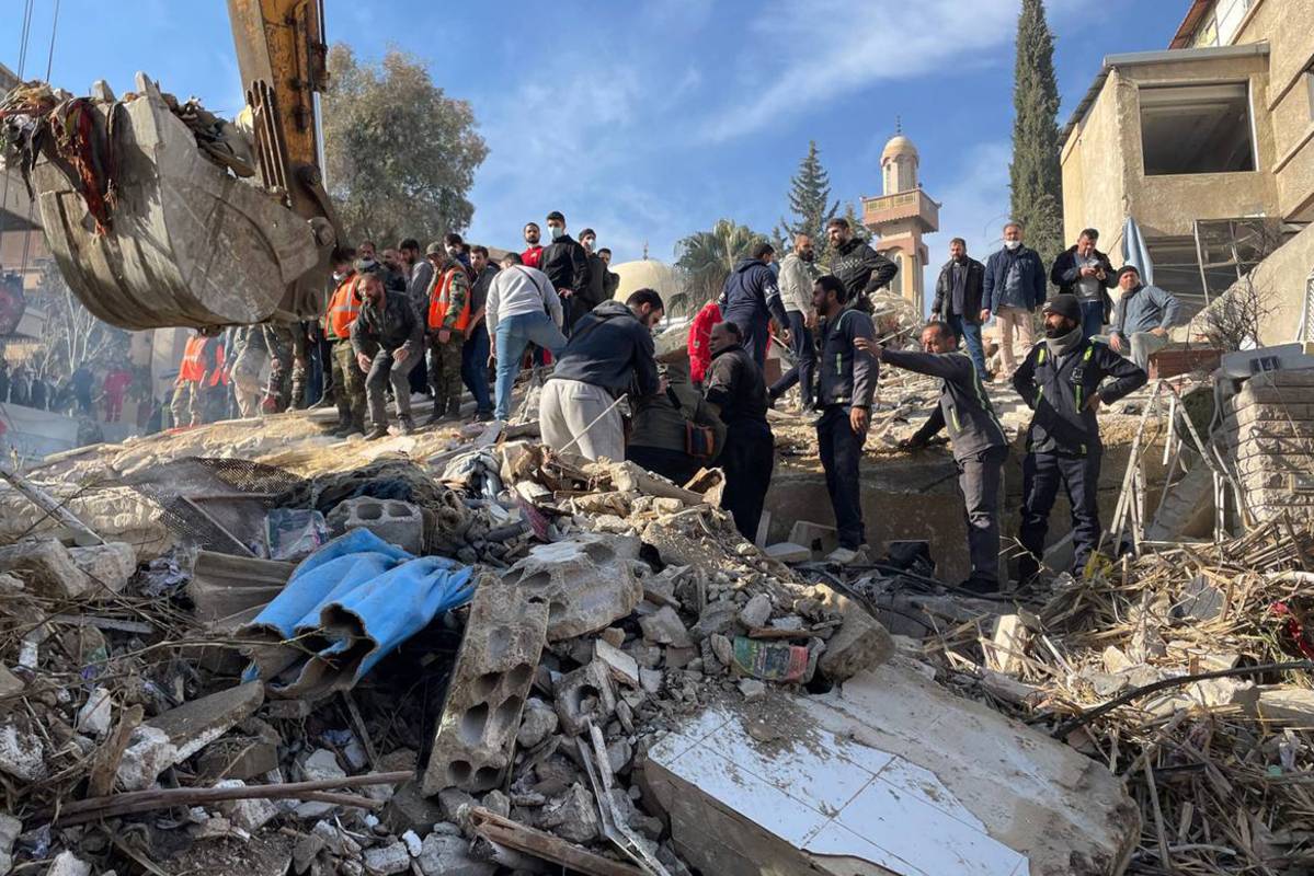 Heavy duty machine removes debris of a destroyed building after Israel's airstrike, which killed 4 commander of Islamic Revolutionary Guard Corps advisers, in Damascus, Syria on January 20, 2024. [Ammar Ghali - Anadolu Agency]
