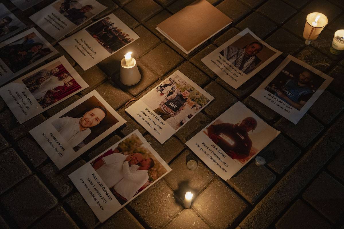 Journalists gather to commemorate the journalists who lost their lives during the Israeli attacks on Gaza since October 7, as the photos of journalists are placed at the demonstration area in Johannesburg, South Africa on January 28, 2024. [Ihsaan Haffejee - Anadolu Agency]