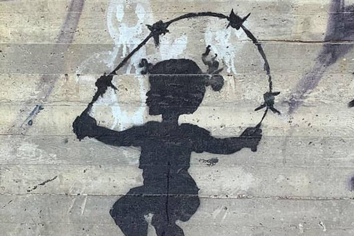 Meet the anonymous artist behind pro-Palestine barbed wire murals on WB Separation Wall