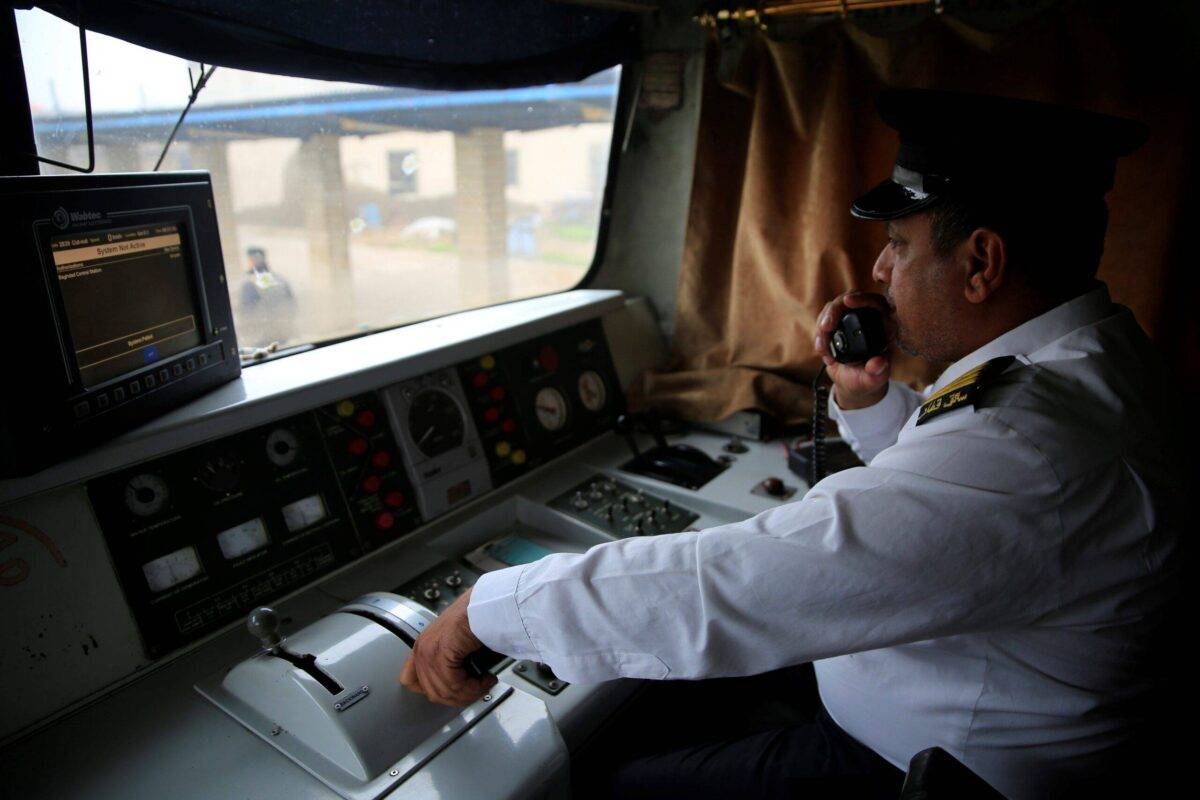 Iraqi train driver operates the train coming from Fallujah as it arrives in the city of Baghdad, Iraq on December 24, 2018 [Haydar Karaalp/Anadolu Agency/Getty Images]