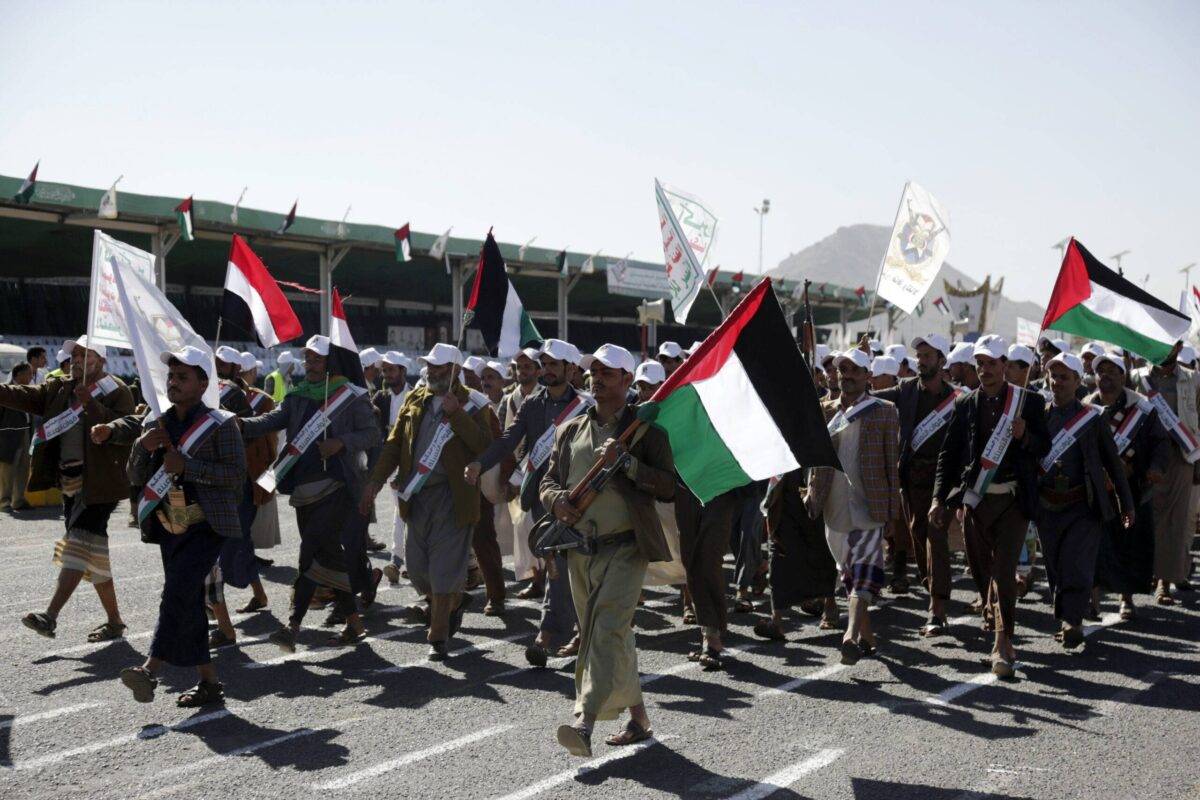 Yemenis recently militarily trained by the Houthi movement march during an armed popular parade held in Al-Sabeen Square Sana'a, Yemen on December 02, 2023 [Mohammed Hamoud/Getty Images]