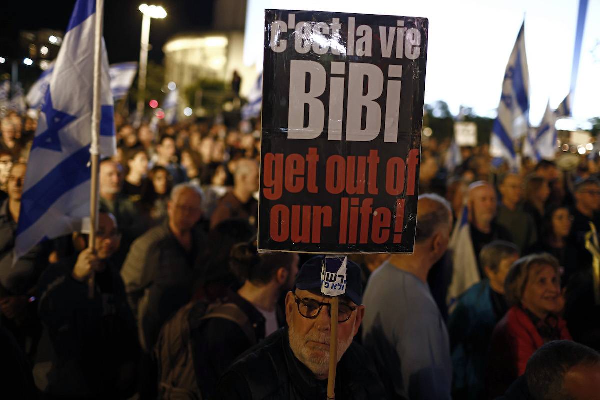Demonstrators during an anti-government protest in Tel Aviv, Israel, on Saturday, Jan. 6, 2024. [Kobi Wolf/Bloomberg via Getty Images]