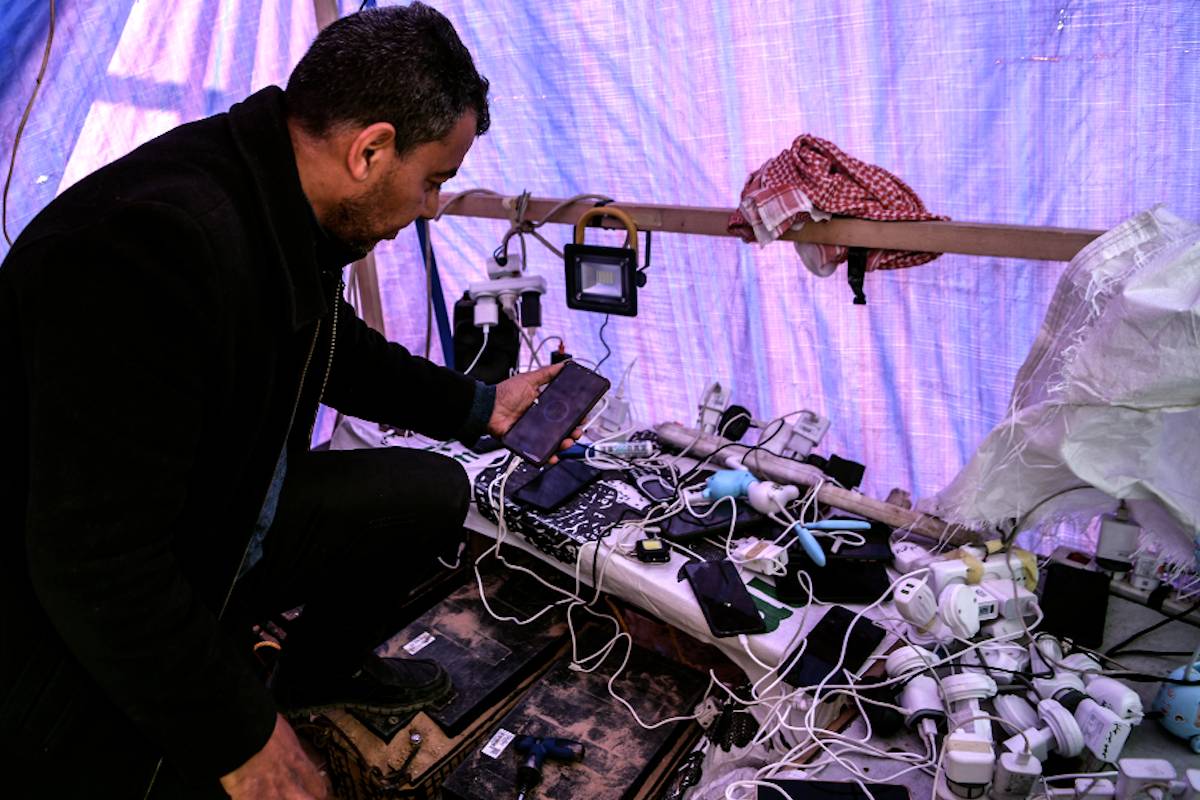 Dispatch from Gaza: Displaced man turns his tent into phone charging station