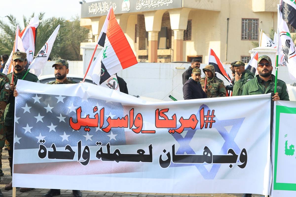 The funeral ceremony of Popular Mobilization Forces (PMF, Hashd al-Shaabi) militia who were killed in the US air strike on the Al-Qaim district of the Al-Anbar province, is held on February 04, 2024 in Baghdad, Iraq. [Murtadha Al-Sudani - Anadolu Agency]