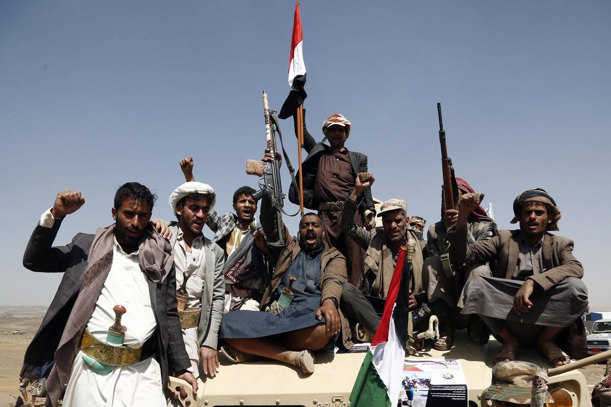 People attend a graduation ceremony for cadet, completed their military training under the name of "Aqsa Flood", organized by the Houthis, in Arhab district of Sana'a, Yemen on February 4, 2024. [Mohammed Hamoud - Anadolu Agency]