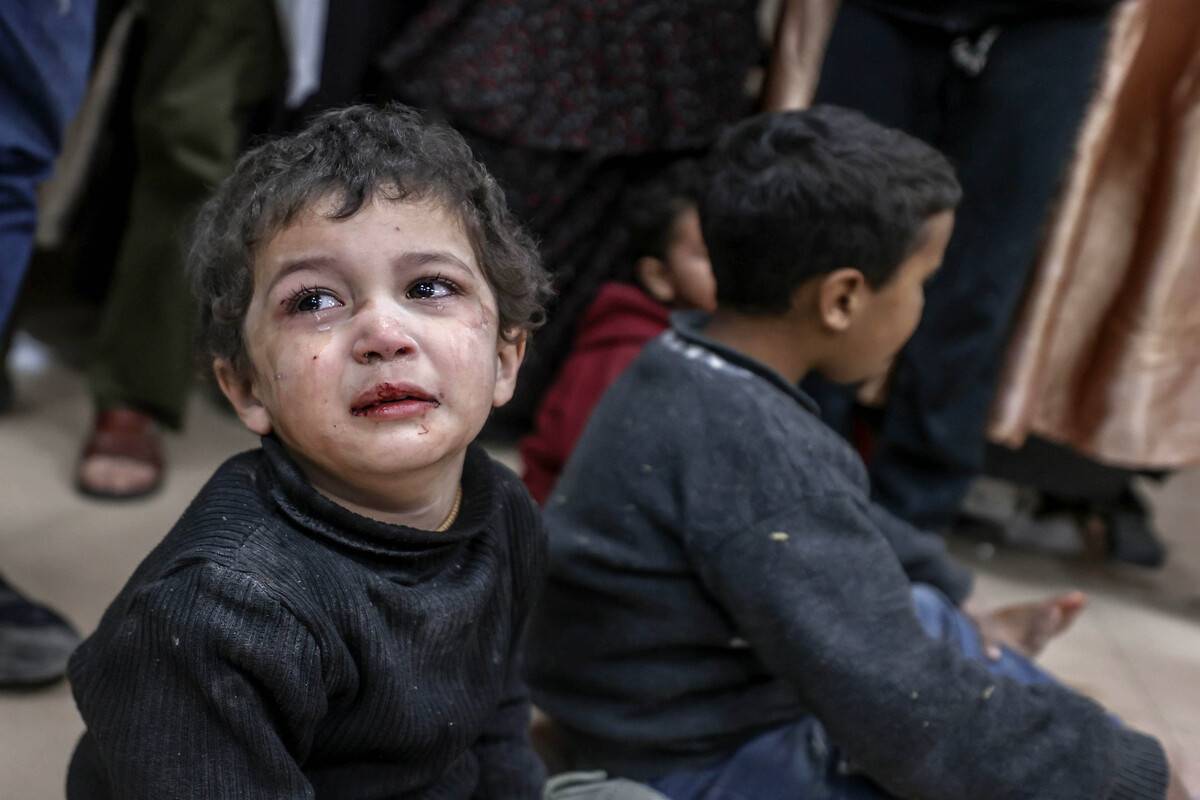 An injured Palestinian child is brought to Al-Aqsa Martyrs Hospital for treatment following the Israeli attacks on a building in Deir Al-Balah, Gaza on February 4, 2024. [Ali Jadallah - Anadolu Agency]