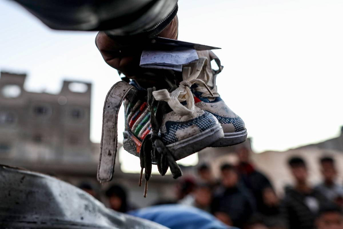 A view of baby shoes found in a destroyed car following the Israeli attacks in Rafah, Gaza on February 7, 2024. [Jehad Alshrafi - Anadolu Agency]