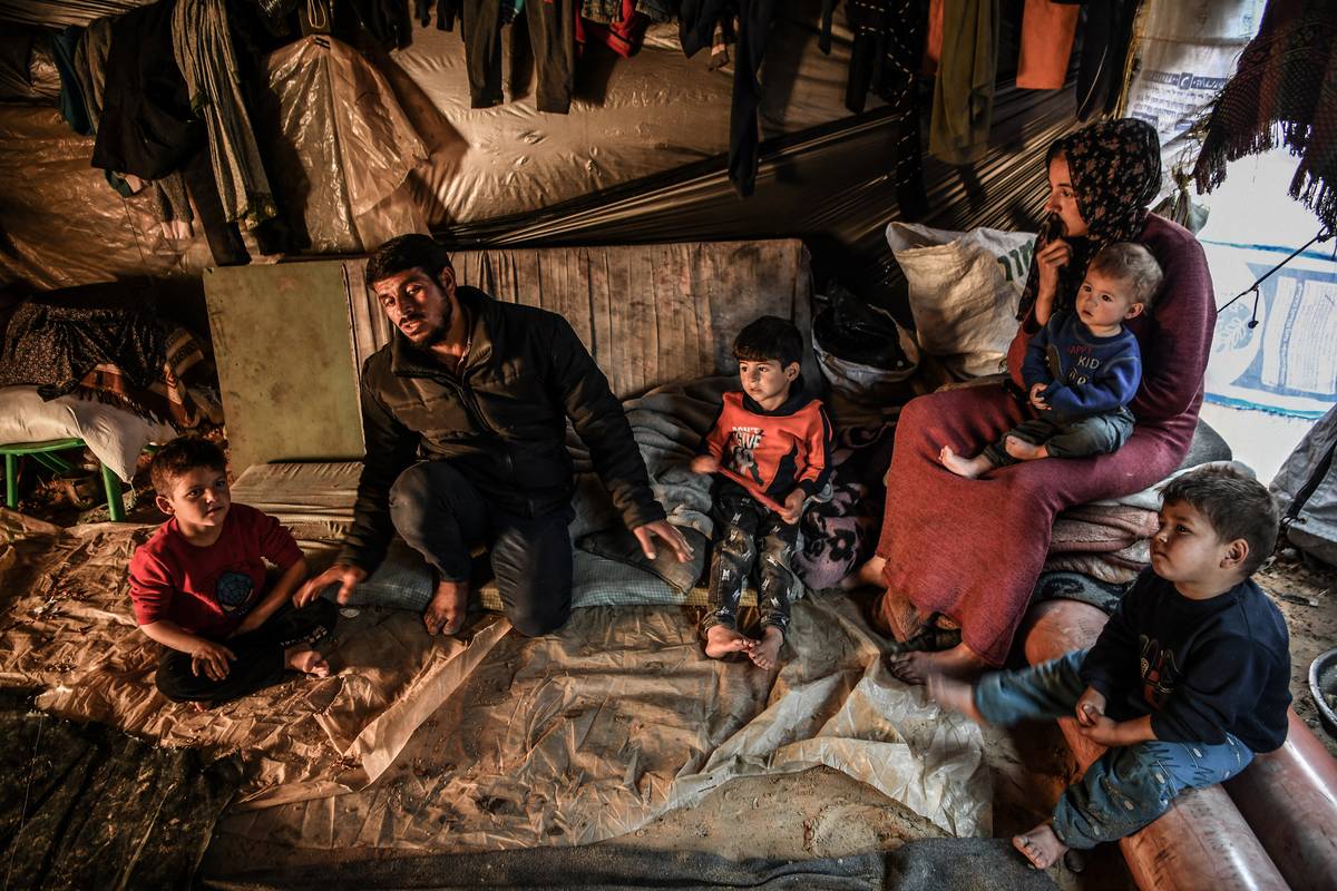 Palestinian families seek refuge at the El-Mavasi district as they struggle to find clean water, food and medicine as the Israeli attacks continue in Rafah, Gaza on February 9, 2024. [Abed Zagout - Anadolu Agency]