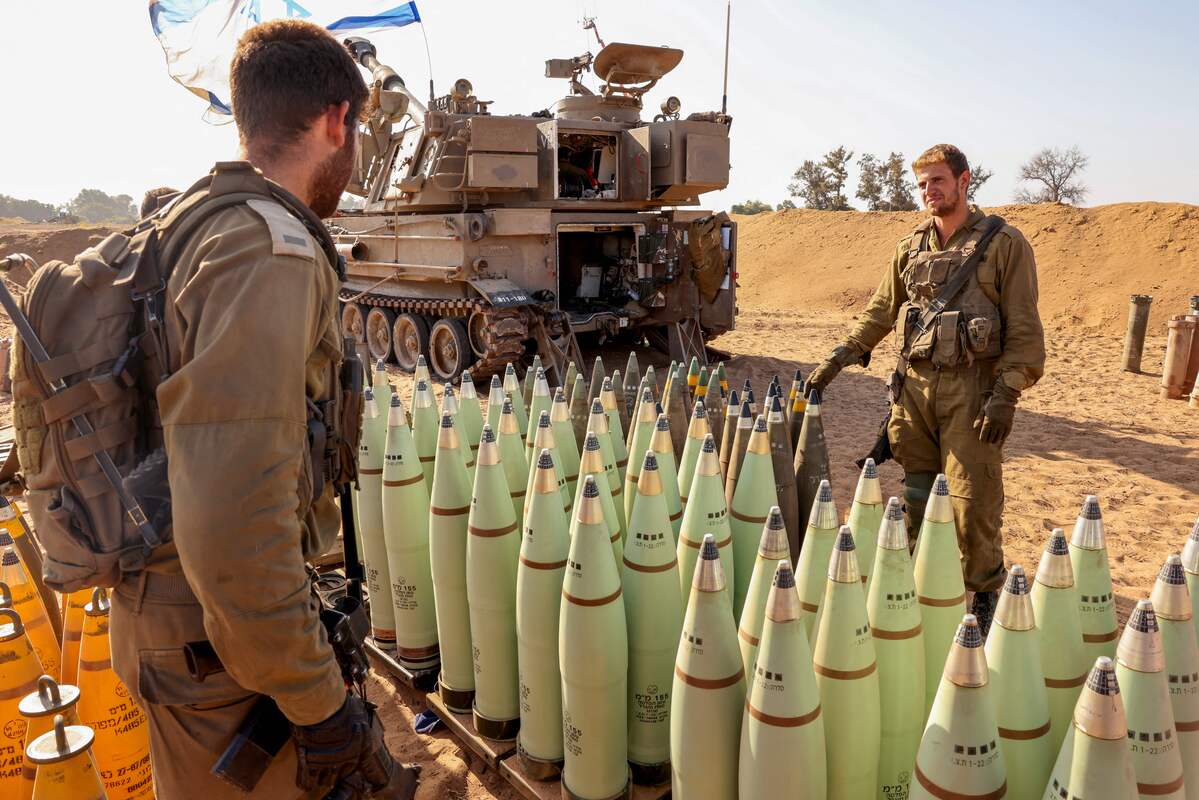An Israeli artillery crew prepares shells at a position near the border with the Gaza Strip in southern Israel on November 6, 2023. [Photo by JACK GUEZ/AFP via Getty Images]