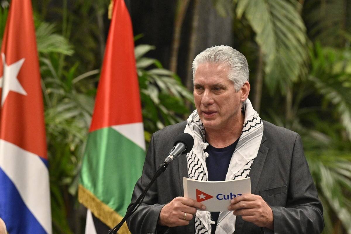 Cuban President Miguel Diaz-Canel delivers a speech wearing a Palestinian kufiya during a meeting with young Palestinian medical students and graduates at the Palace of the Revolution in Havana on November 17, 2023. [Photo by ADALBERTO ROQUE/AFP via Getty Images]