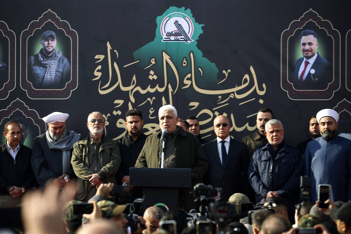 Faleh al-Fayyad (C), the head of the of Iraq's Hashed al-Shaabi (Popular Mobilisation) paramilitary forces, speaks during of the funeral of people killed the previous day in US strikes in western Iraq, in Baghdad on January 4, 2024. [AHMAD AL-RUBAYE / AFP]