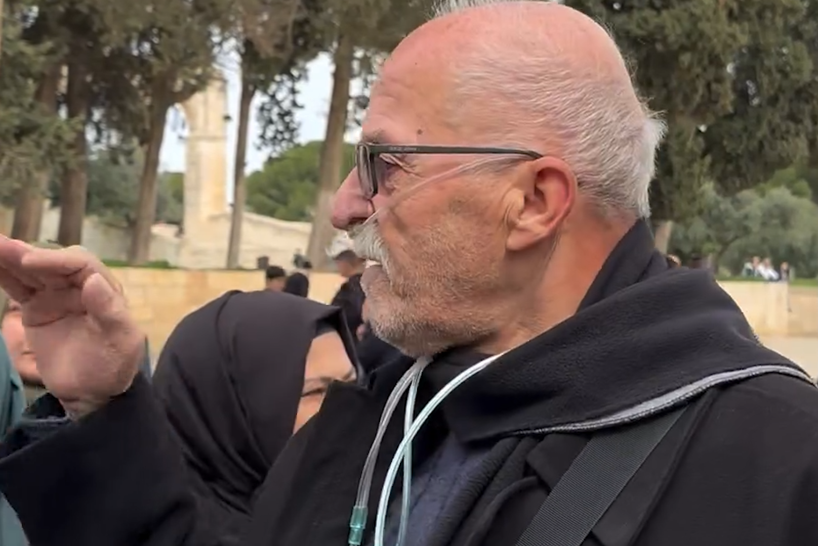 A man addresses Turkish President Erdogan from Al-Aqsa Mosque