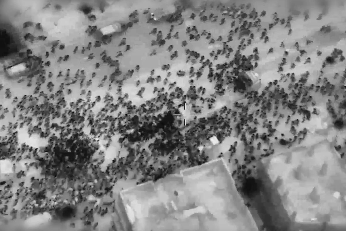 A screen grab captured from a video shows Israeli forces targeting Palestinians, surrounding humanitarian aid trucks, as Israeli soldiers receive them as a threat and open fire on the crowd in Gaza City, Gaza on February 29, 2024. [Stringer - Anadolu Agency]