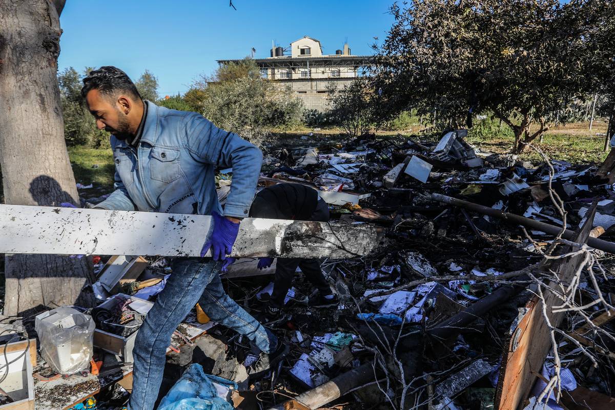Palestinians collect remaining belongings from the rubble of destroyed house after Israeli attacks on the house belonging to the Berakat family as Israel's air, land and sea attacks continue on the Gaza Strip on March 11, 2024 in Rafah, Gaza. [Abed Rahim Khatib - Anadolu Agency]