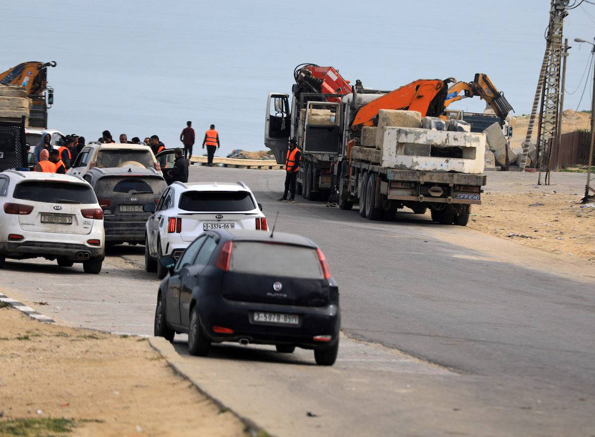 A view of construction machines, loaded with stone blocks from Khan Yunis, as construction of the temporary port, to be built to ensure the entry of humanitarian aid to Gaza, still continues in Gaza City, Gaza on March 14, 2024. [Yasser Qudaih - Anadolu Agency]