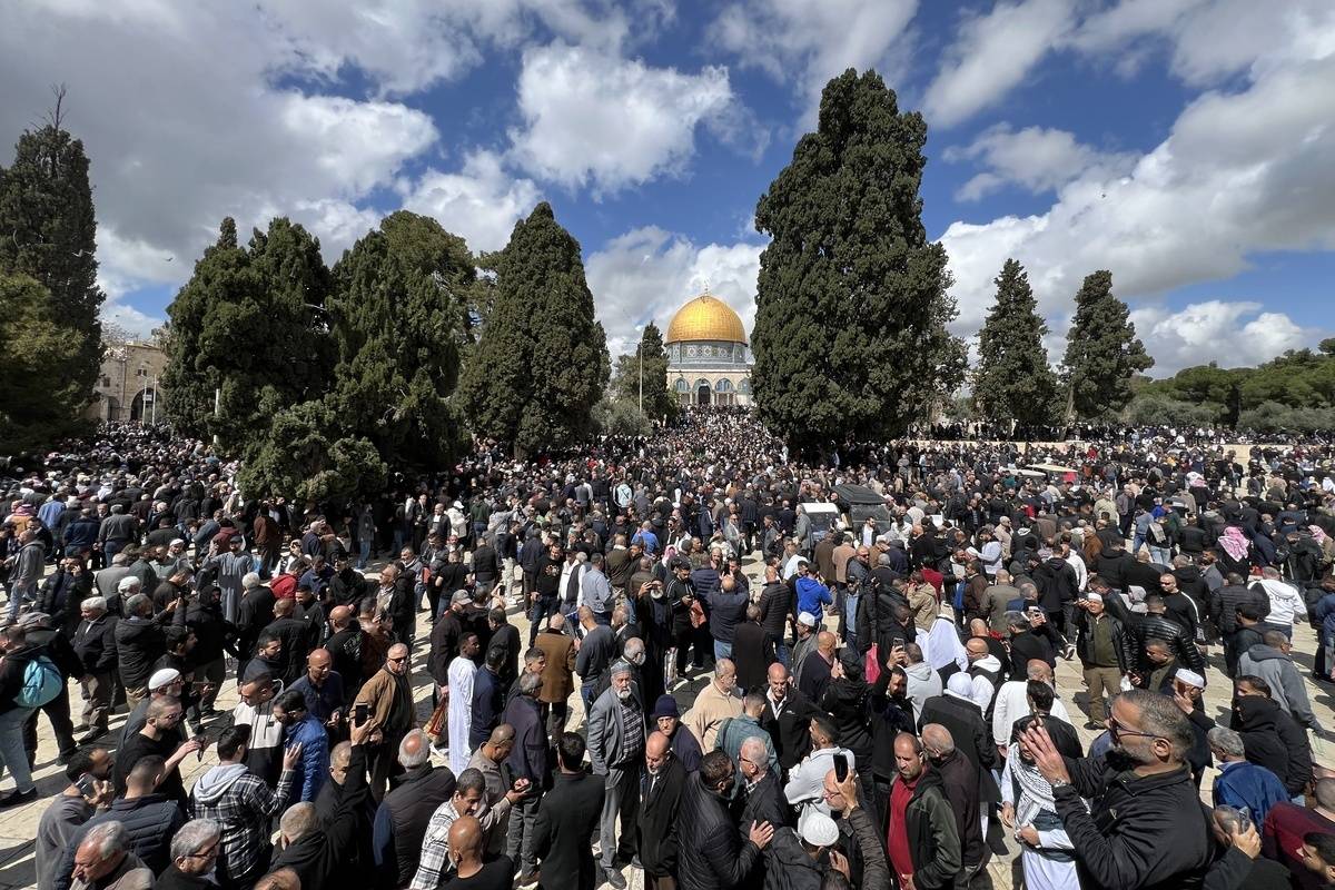 Palestinians perform the first Friday prayer of Ramadan despite extensive Israeli restrictions at the Al-Aqsa Mosque in East Jerusalem on March 15, 2024. [Mohammad Hamad - Anadolu Agency]